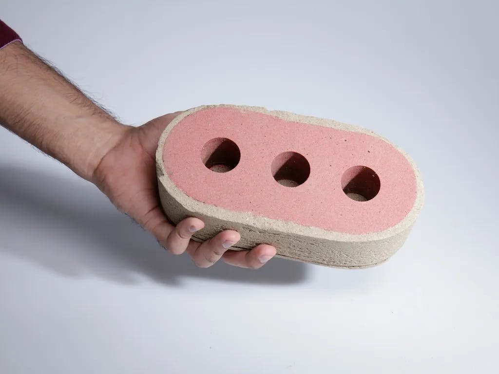 Image of Finite being cast into a normal brick shape